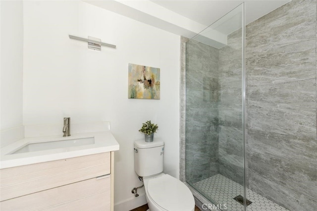 bathroom with vanity, toilet, and walk in shower