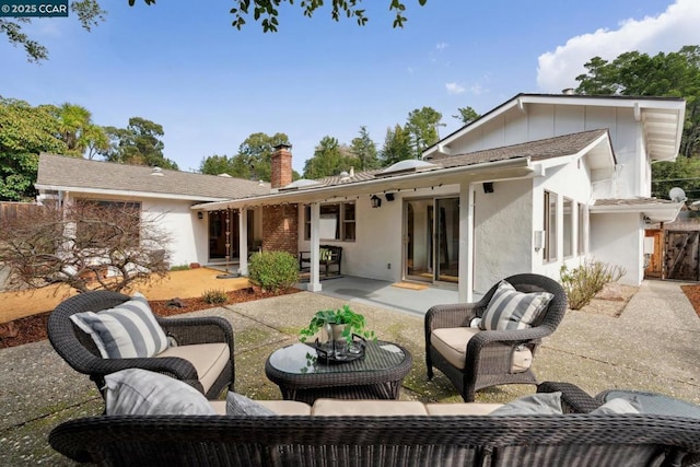 back of house featuring an outdoor hangout area and a patio area