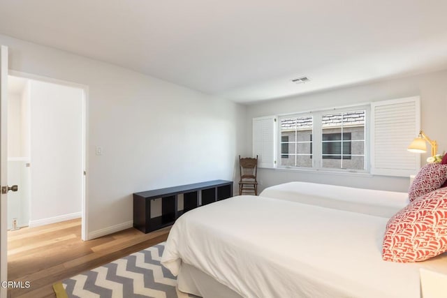 bedroom with wood-type flooring