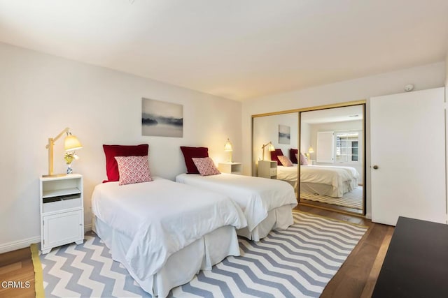 bedroom featuring a closet and light wood-type flooring