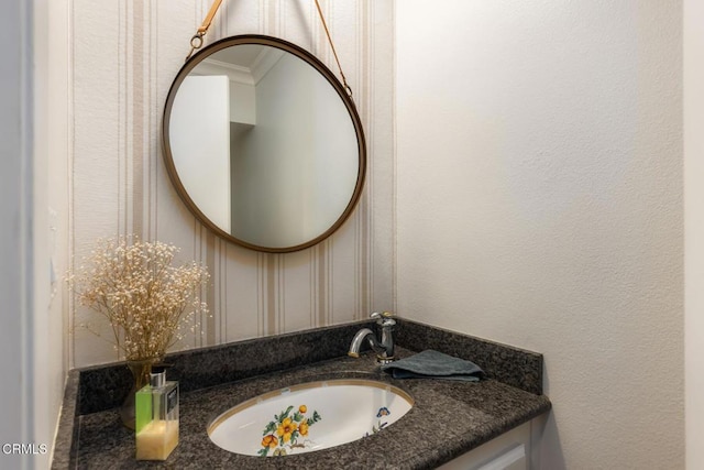 bathroom with vanity and crown molding