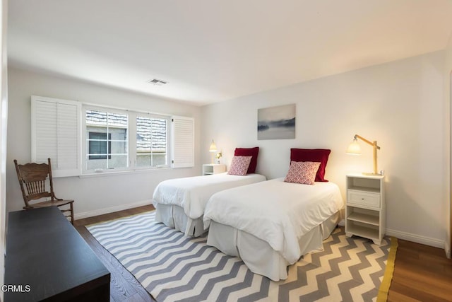 bedroom with hardwood / wood-style floors