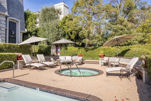 view of pool featuring an outdoor hangout area, a patio area, and a hot tub