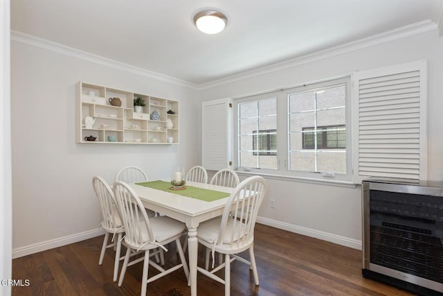 dining area with wine cooler, ornamental molding, and dark wood-type flooring