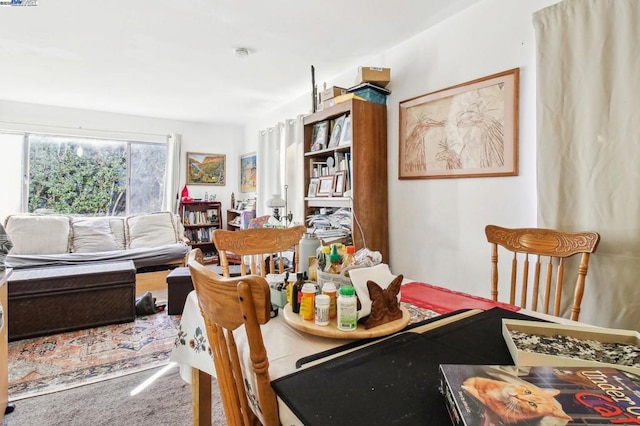 dining space featuring carpet flooring