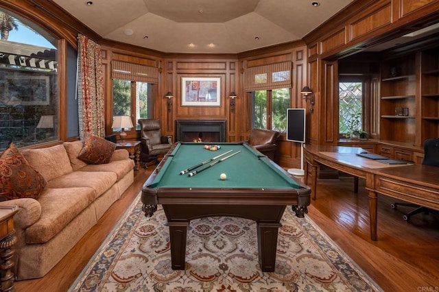 7756 St Andrews Rd, Rancho Santa Fe, CA 92067 - playroom featuring built in shelves, crown molding, billiards, wood finished floors, and wood walls