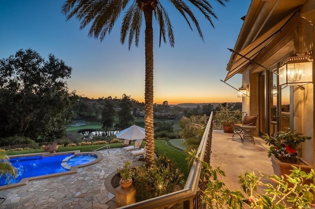 7756 St Andrews Rd, Rancho Santa Fe, CA 92067 - pool at dusk with a patio, a pool with connected hot tub, and fence