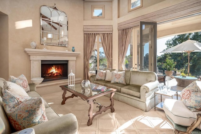 7756 St Andrews Rd, Rancho Santa Fe, CA 92067 - living room featuring a fireplace and a towering ceiling