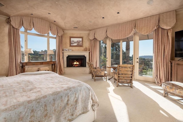 7756 St Andrews Rd, Rancho Santa Fe, CA 92067 - bedroom with a lit fireplace, access to outside, visible vents, and carpet floors