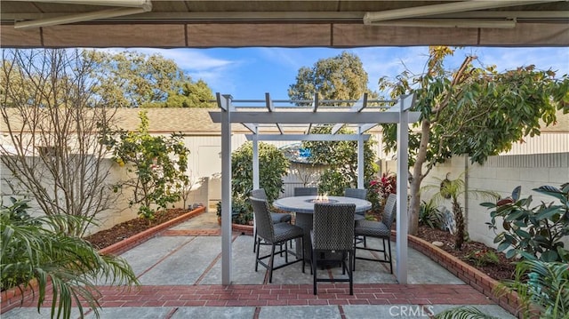 view of patio / terrace featuring a fenced backyard, outdoor dining space, and a pergola