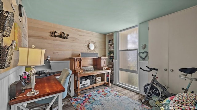 office featuring wood walls and wood finished floors