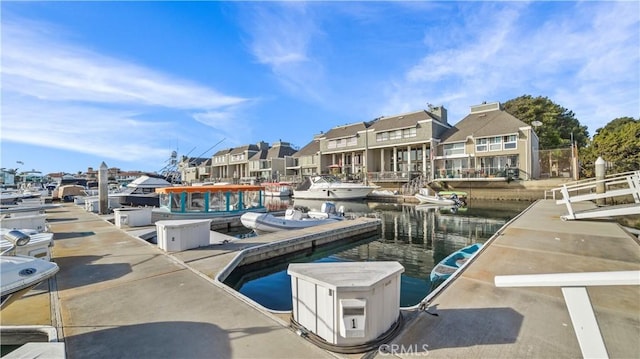 dock area with a water view and a residential view