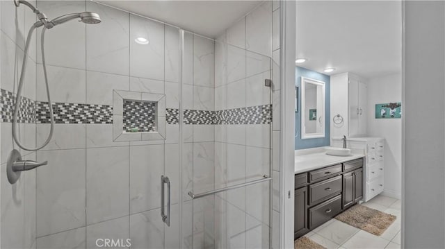 bathroom featuring a shower stall and vanity