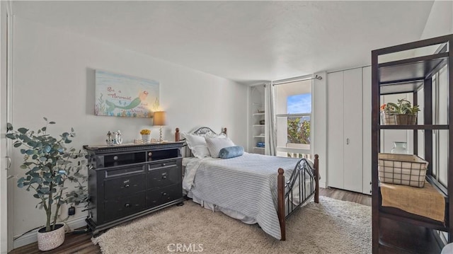 bedroom featuring light wood-style flooring