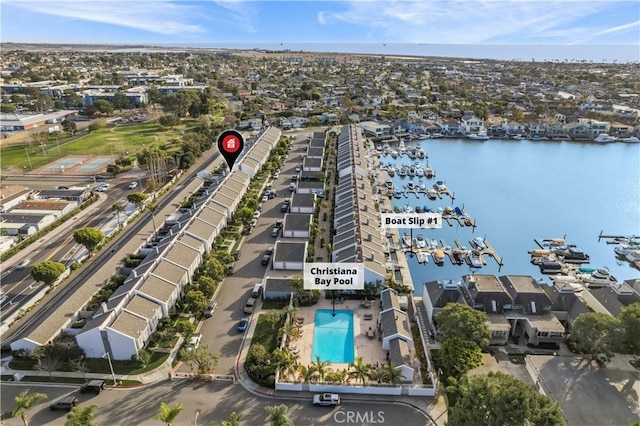 drone / aerial view with a water view and a residential view