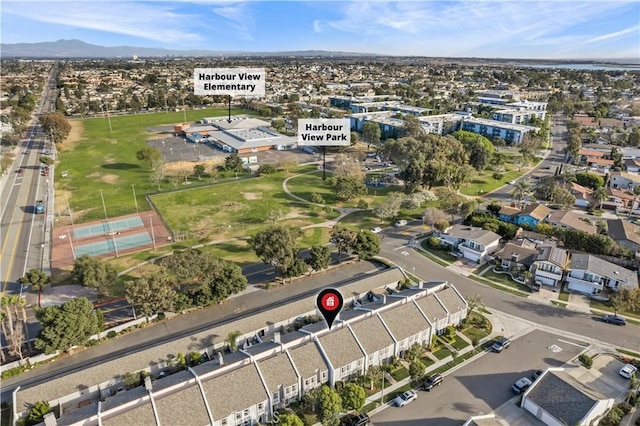 drone / aerial view featuring a residential view and a mountain view
