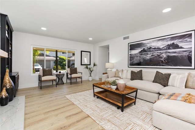 living room with light hardwood / wood-style floors