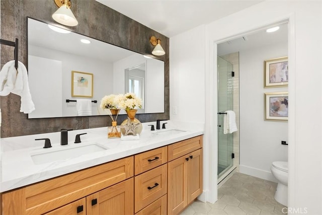 bathroom with tile patterned flooring, vanity, an enclosed shower, and toilet