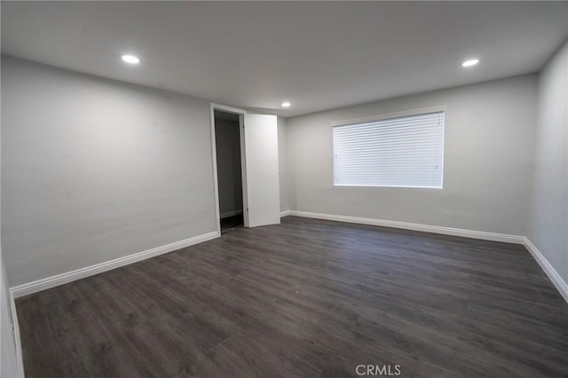 unfurnished room featuring dark hardwood / wood-style floors