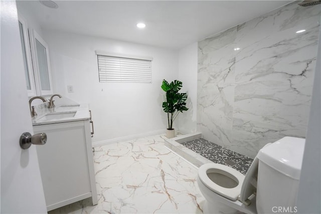 bathroom featuring walk in shower, vanity, and toilet