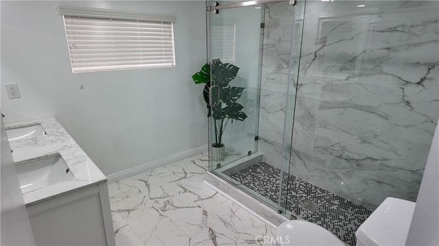 full bath featuring toilet, baseboards, marble finish floor, a marble finish shower, and double vanity