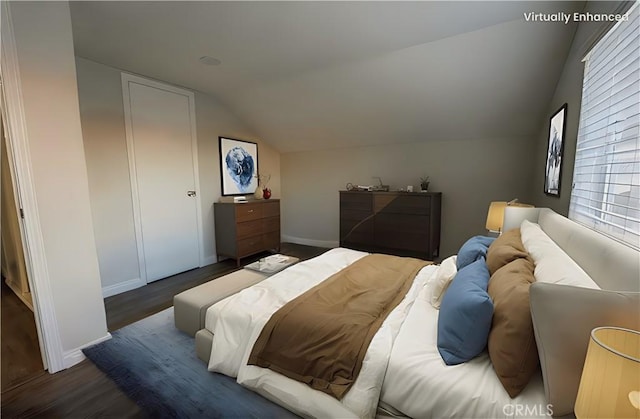 bedroom with dark wood-type flooring, vaulted ceiling, and baseboards