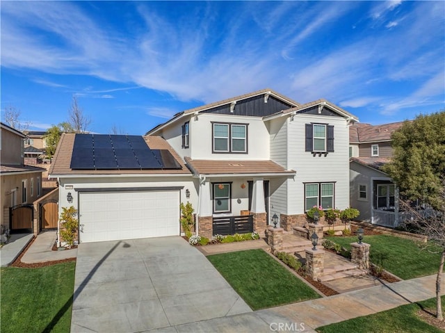 craftsman-style home featuring a garage, a porch, a front lawn, and solar panels