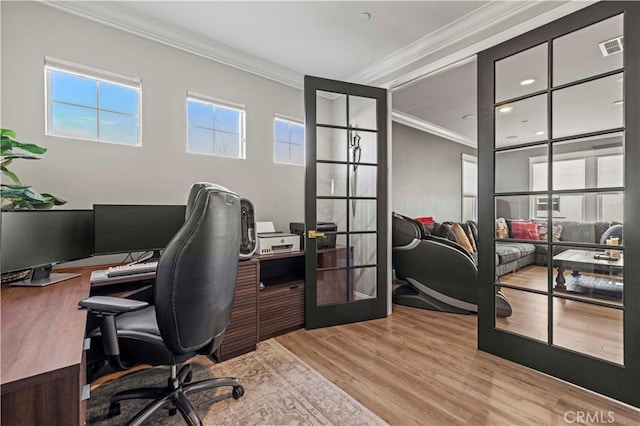 office area featuring crown molding, light wood-type flooring, and french doors