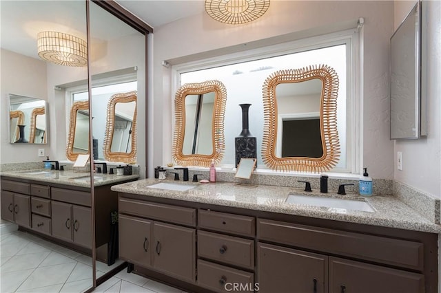 bathroom featuring tile patterned floors and vanity