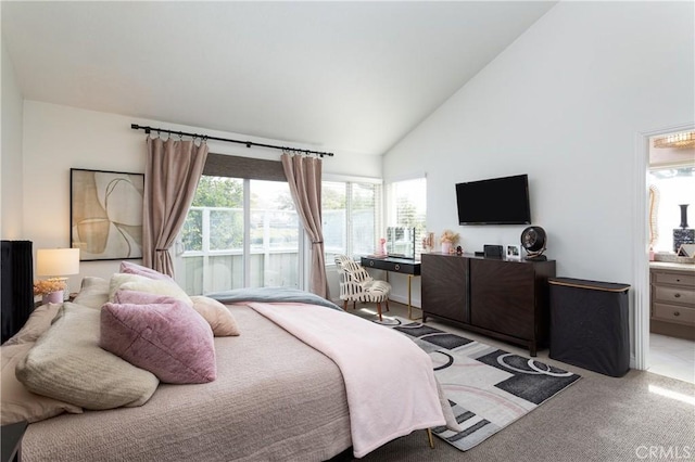 bedroom with high vaulted ceiling and light carpet