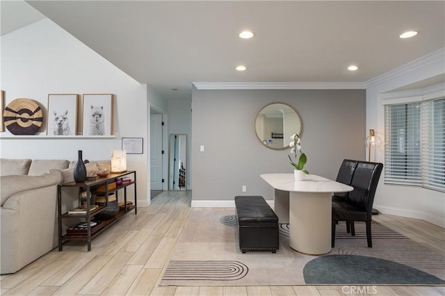 dining space with crown molding