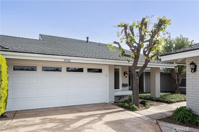 ranch-style home featuring a garage