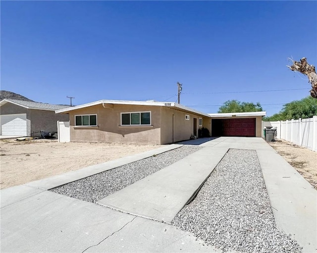 single story home with a garage