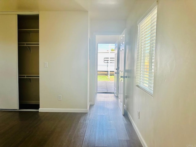 hall with dark hardwood / wood-style flooring