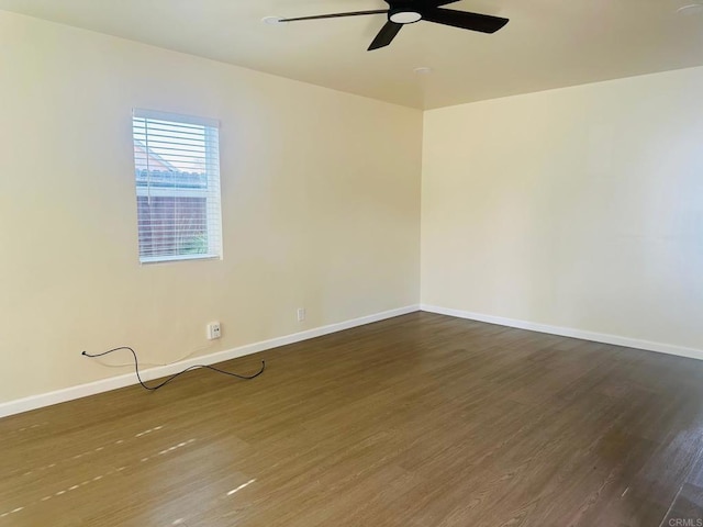 unfurnished room featuring dark hardwood / wood-style floors and ceiling fan