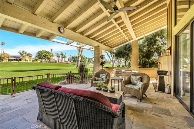 view of patio / terrace with ceiling fan and an outdoor living space