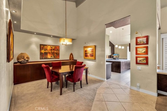 dining area featuring light colored carpet