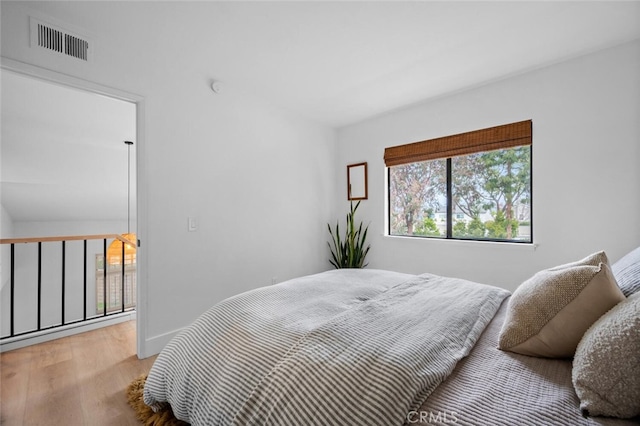 bedroom featuring hardwood / wood-style flooring