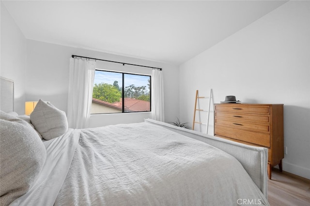 bedroom with lofted ceiling