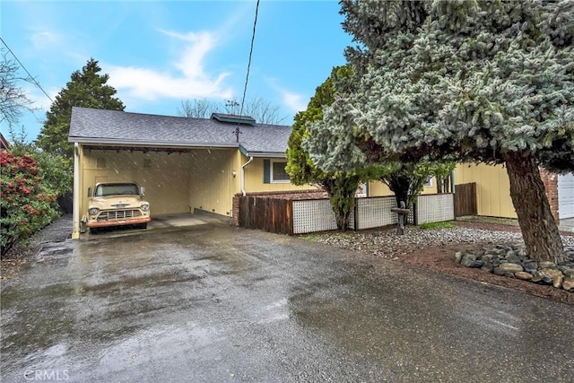 view of property exterior with a carport