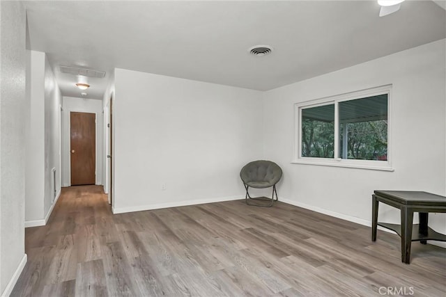 spare room featuring light hardwood / wood-style flooring