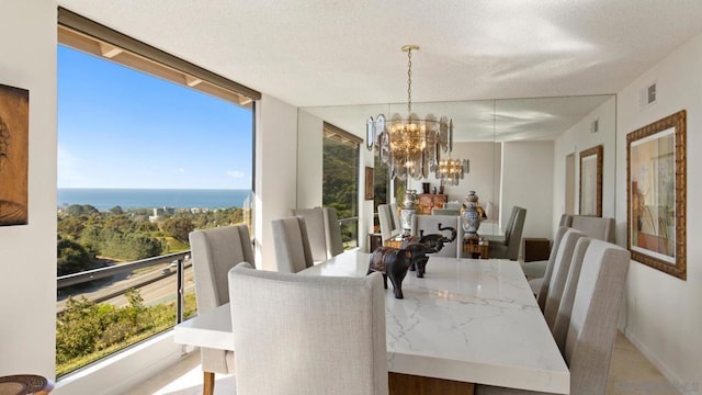 dining area featuring floor to ceiling windows, a healthy amount of sunlight, and a notable chandelier