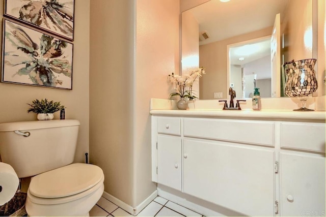 bathroom with vanity, tile patterned floors, and toilet