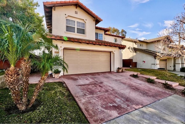 mediterranean / spanish house featuring a garage