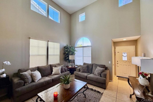 living room featuring light tile patterned floors and a healthy amount of sunlight