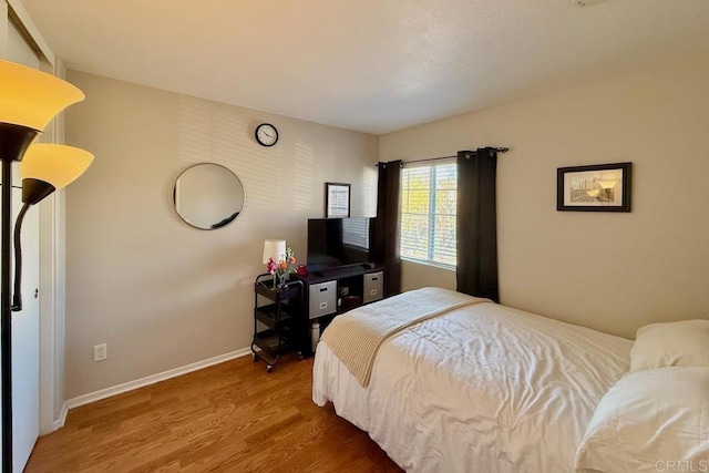 bedroom featuring wood-type flooring