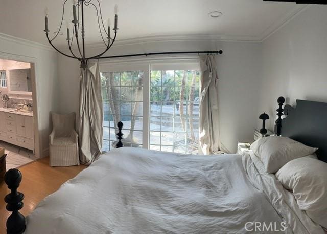 bedroom featuring connected bathroom, ornamental molding, and light wood-type flooring