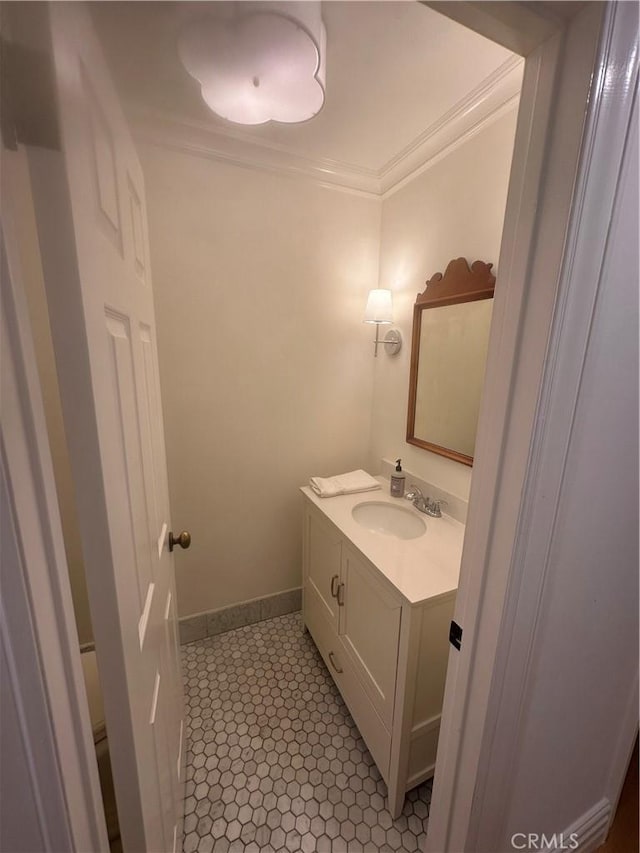 bathroom featuring ornamental molding and vanity