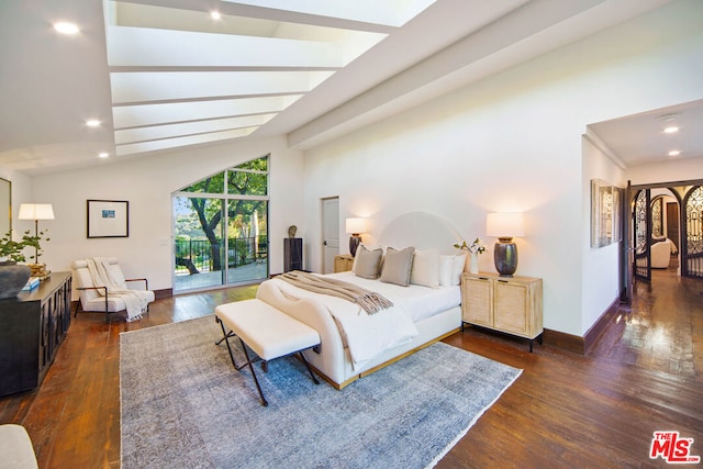 bedroom featuring vaulted ceiling, dark hardwood / wood-style floors, and access to exterior