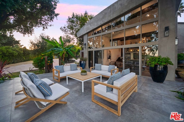 patio terrace at dusk with outdoor lounge area